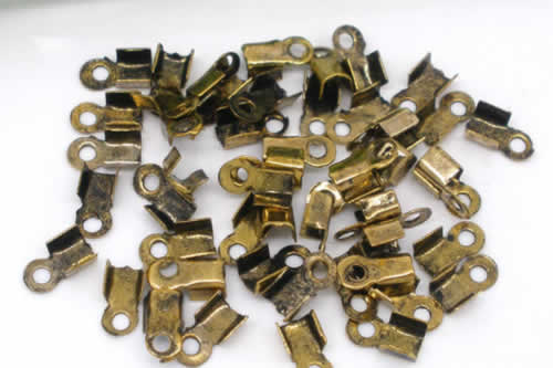 20 stuks koordklem oud goudkleurig