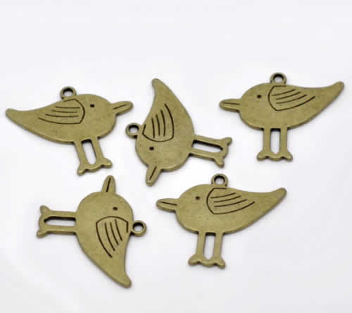 1x Bedeltje Brons Vogeltje 32 x 27 mm