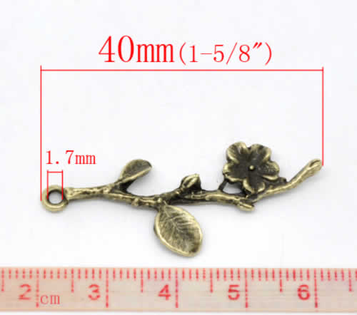 1x Bedeltje Brons Bloemtakje