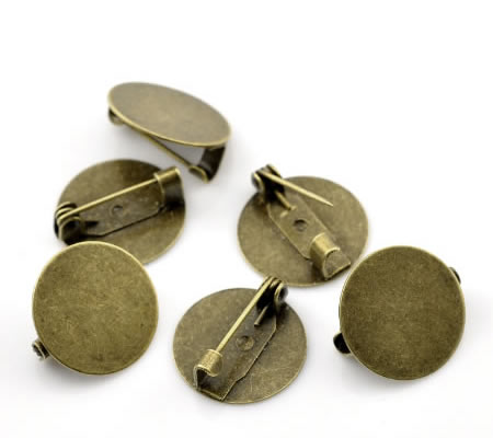 1x Broche plakspeldje Brons