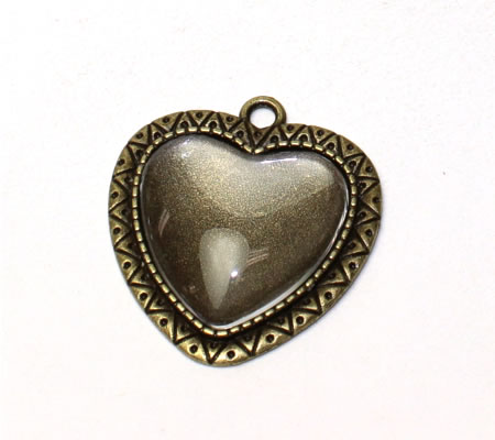 1x cabochonbedel Brons incl, glascabochon