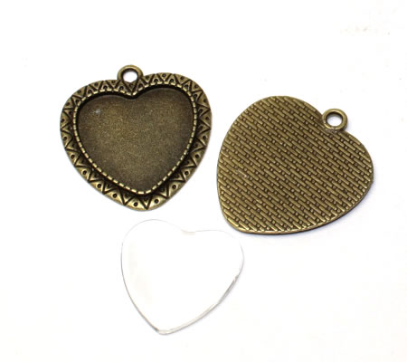 1x cabochonbedel Brons incl, glascabochon