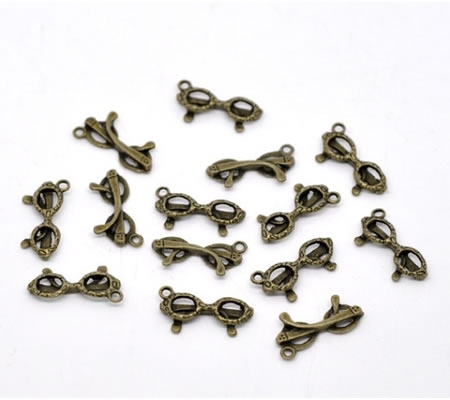 1x Bedeltje Zonnebrilletje Brons