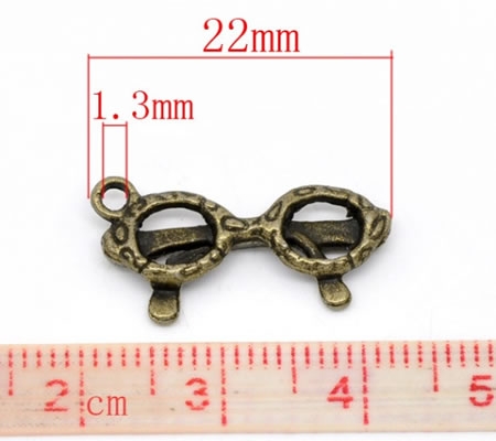 1x Bedeltje Zonnebrilletje Brons