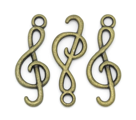 1x Bedeltje Brons Muzieksleutel